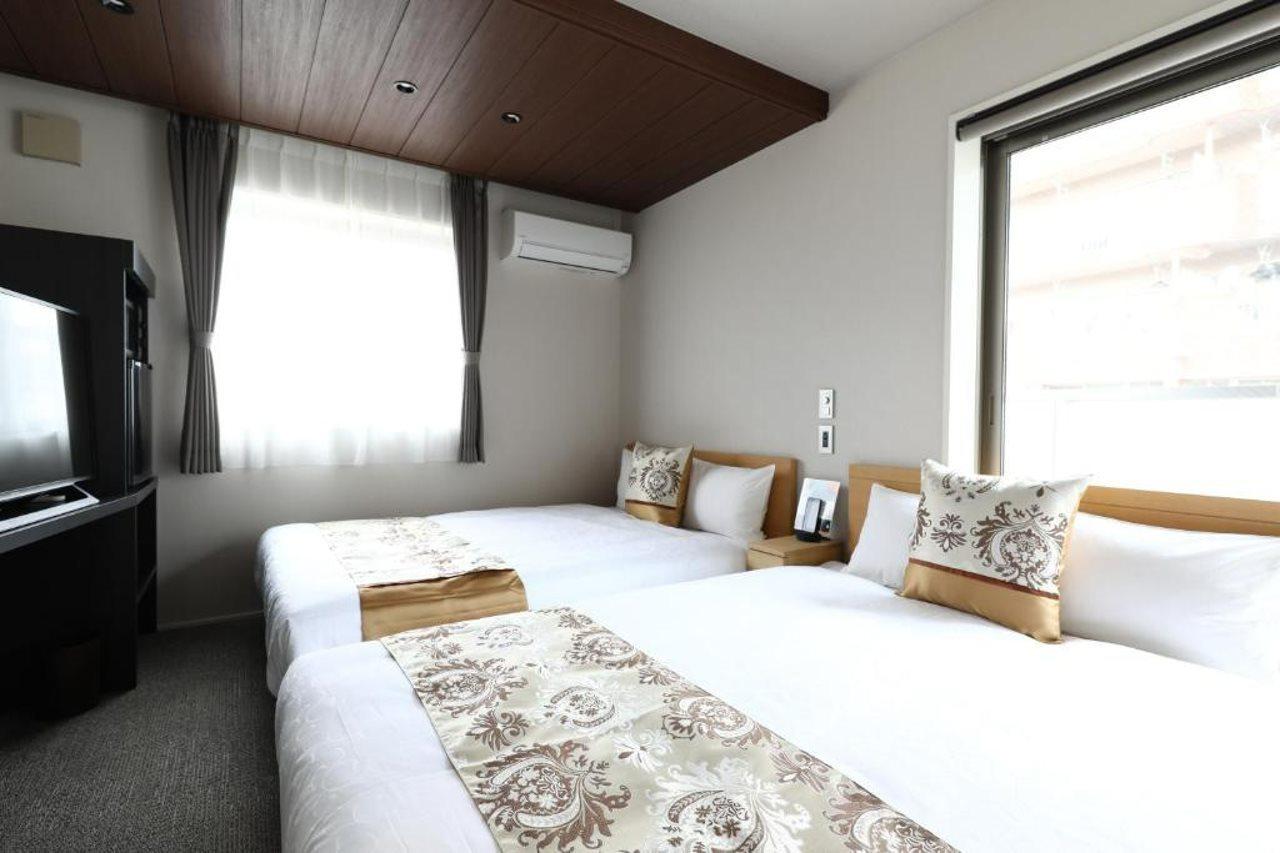 แกรนด์ เบส ฮากาตะซิตี้ Aparthotel ฟูกุโอกะ ภายนอก รูปภาพ